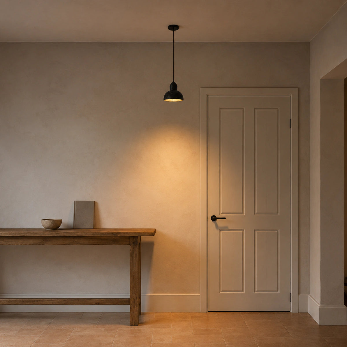 Blackmoor black travertine dome pendant lighting a hallway in a period property