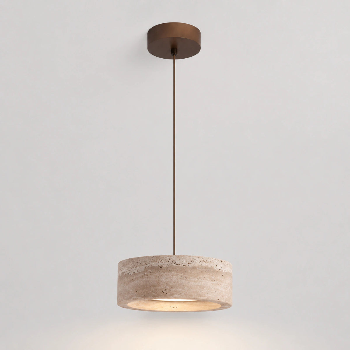 Wide travertine drum pendant with straight sides on a white background