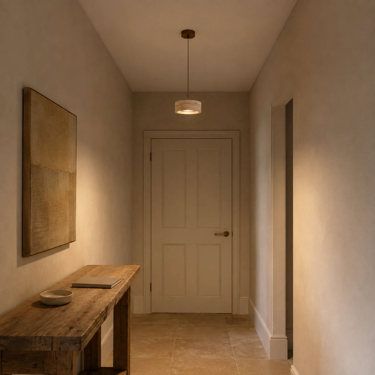 Wide travertine drum pendant lighting a plastered hallway