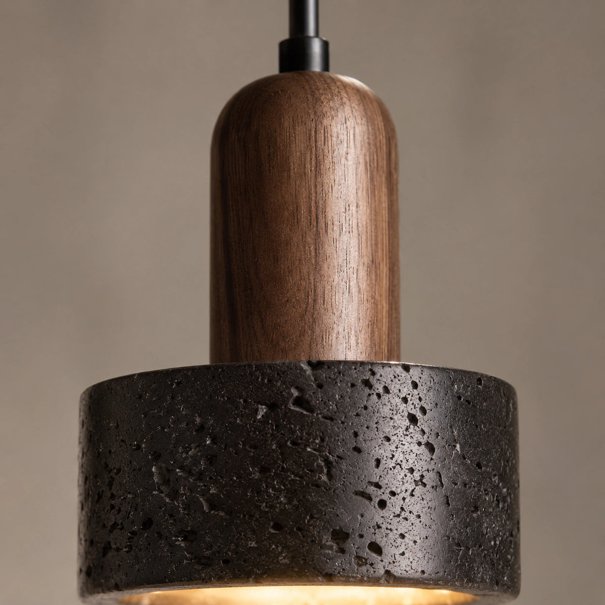 Close-up of the pale flecks in the black travertine on the Grantley drum pendant