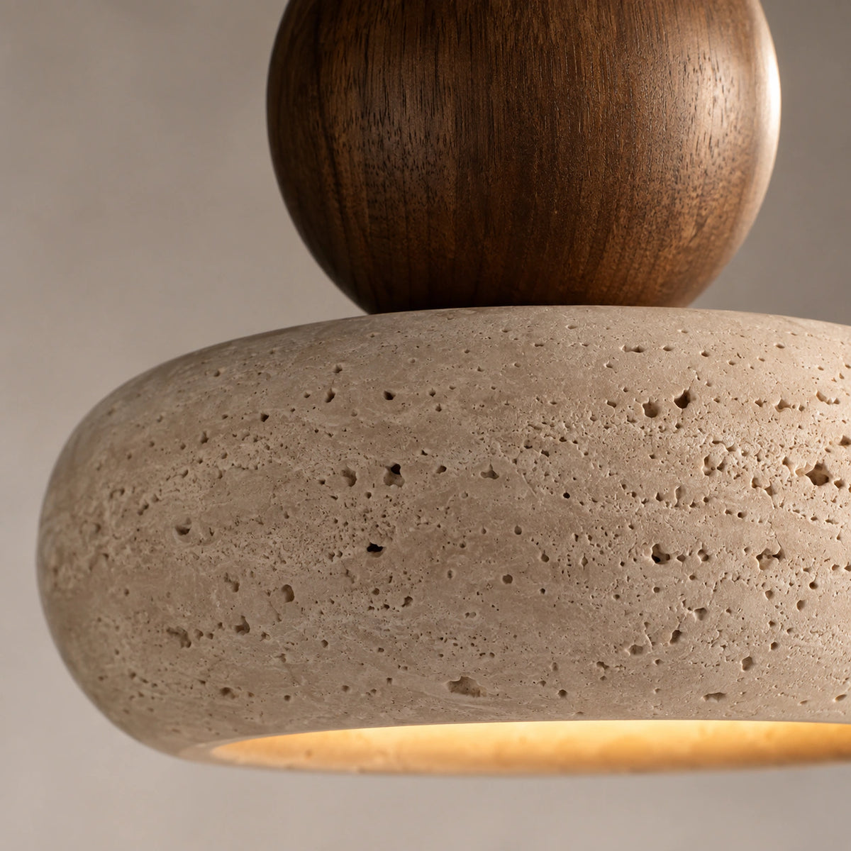 Close-up of the travertine grain on the pebble pendant shade