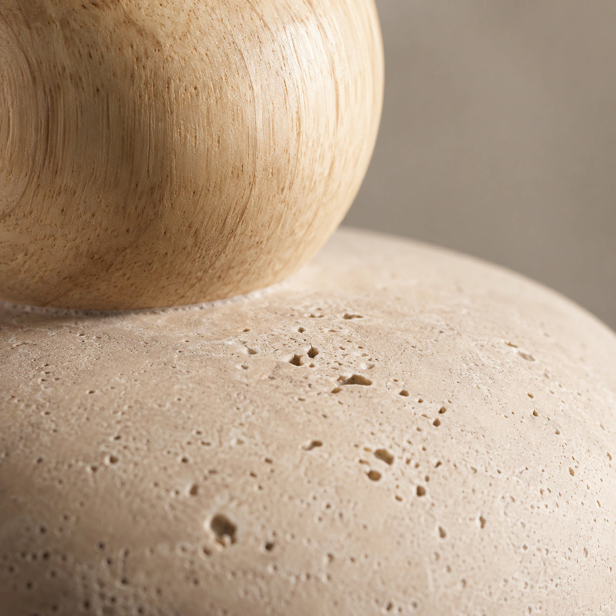 Close-up of the travertine grain on the oak version of the pebble pendant