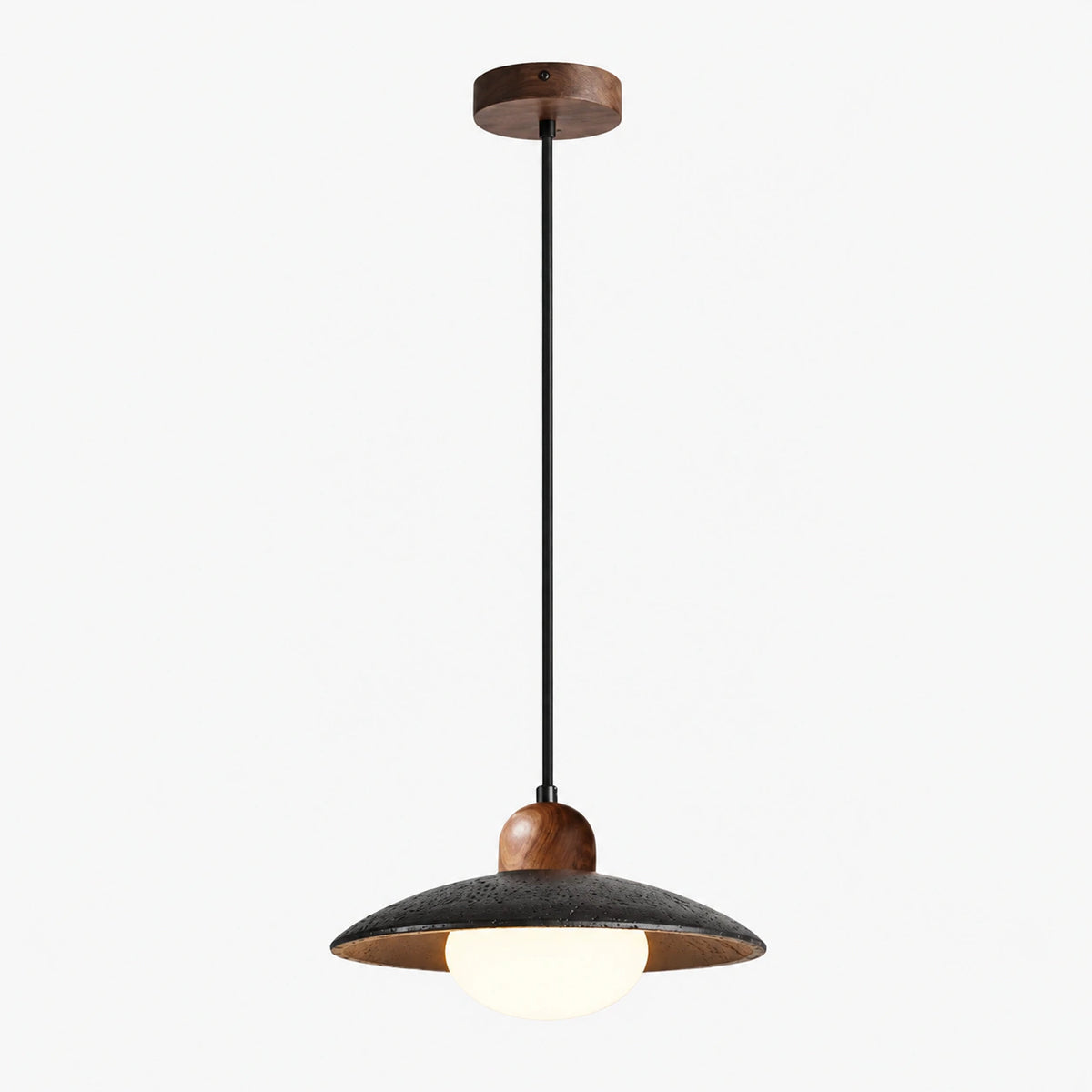 Black travertine saucer pendant light with a wood lining and opal glass globe on a white background