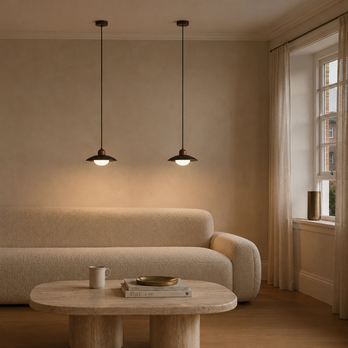 Marsden black travertine saucer pendant in a calm living room with neutral furnishings