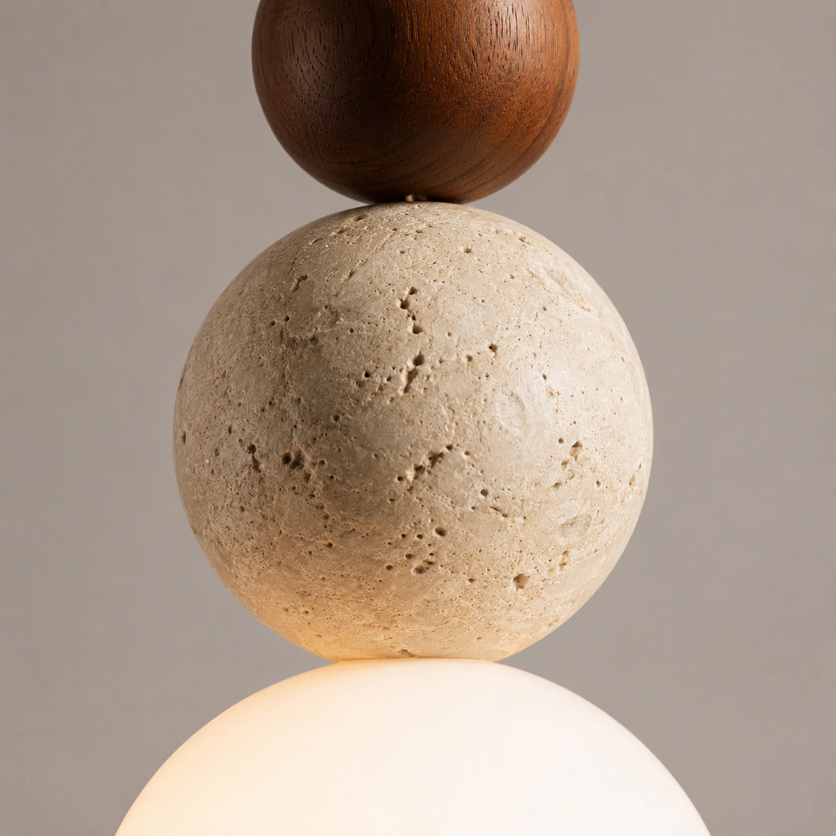 Close-up of the travertine sphere and walnut ball on the Sudbury pendant