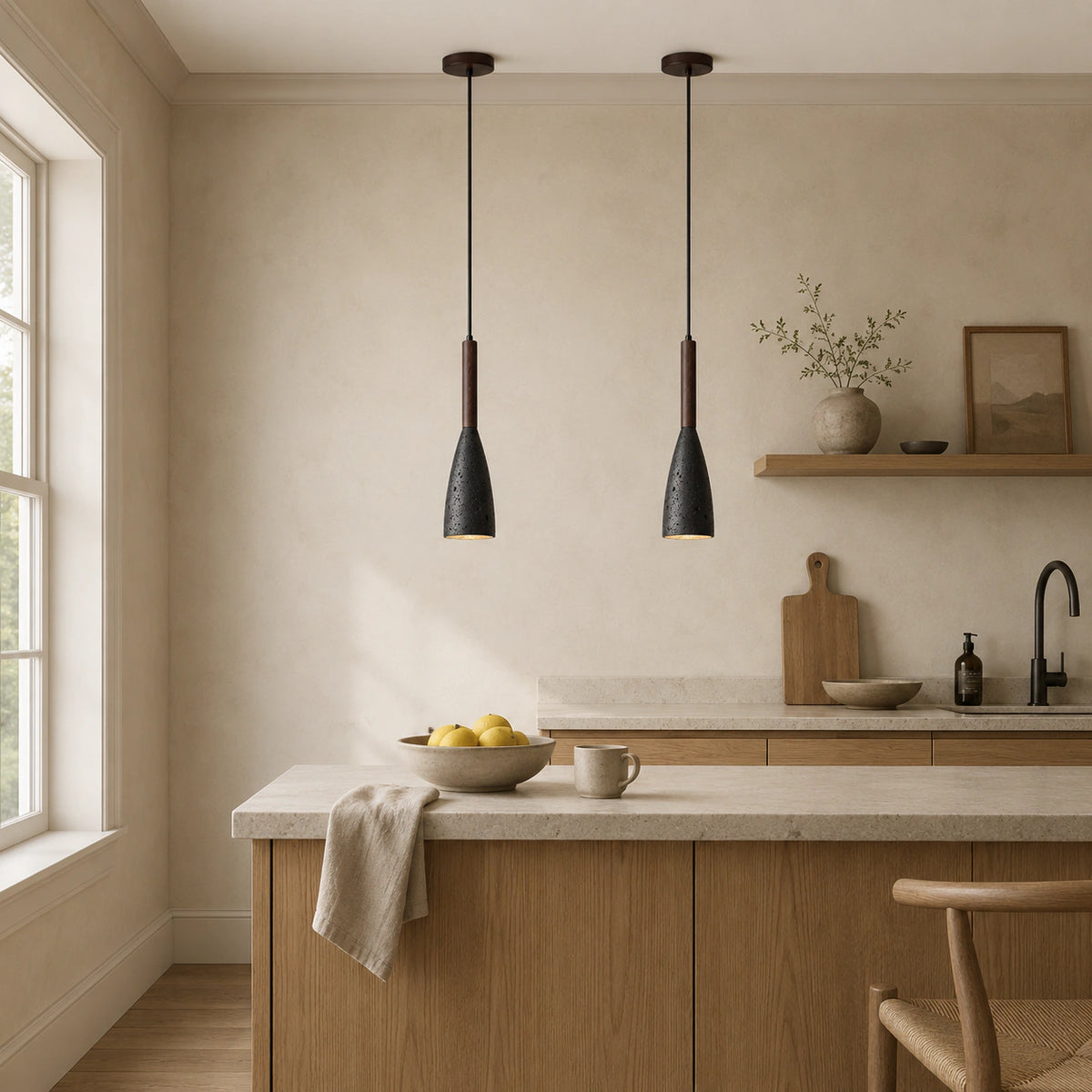 Coalbrook tall black travertine pendant hanging above a kitchen island