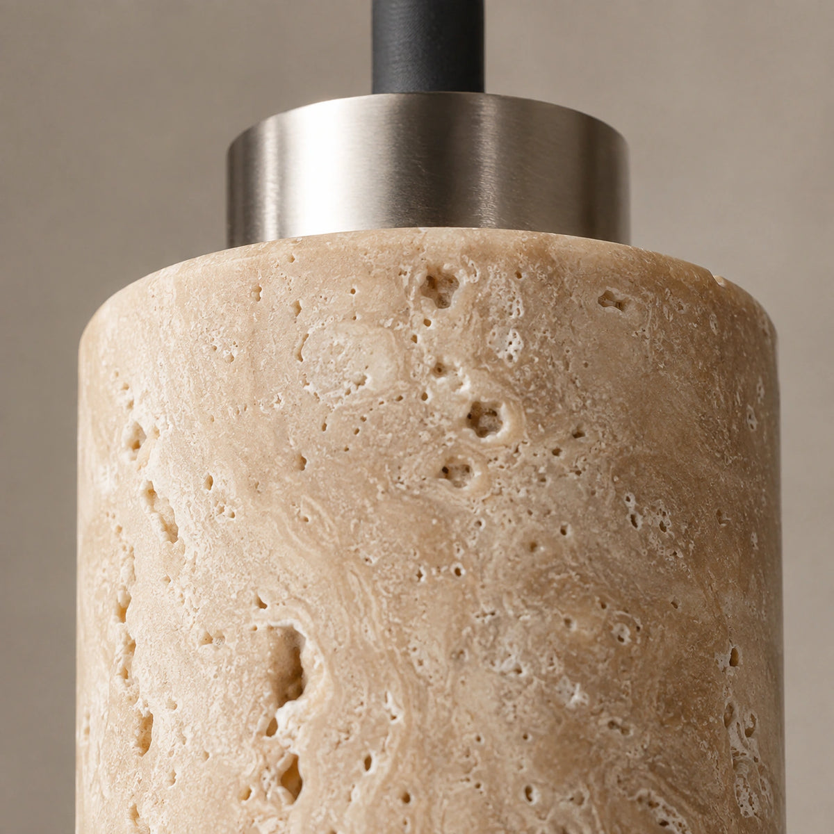 Close-up of the travertine grain on the two tubes of the Chesil cluster pendant
