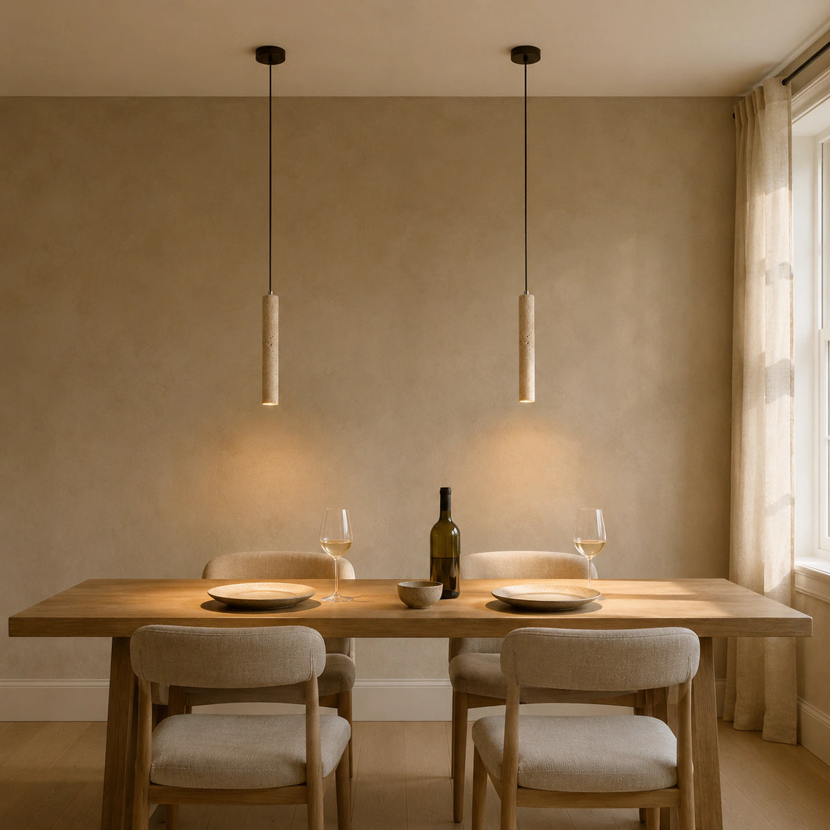 Reed travertine tube pendants in 40 cm above a dining table in a minimalist dining room