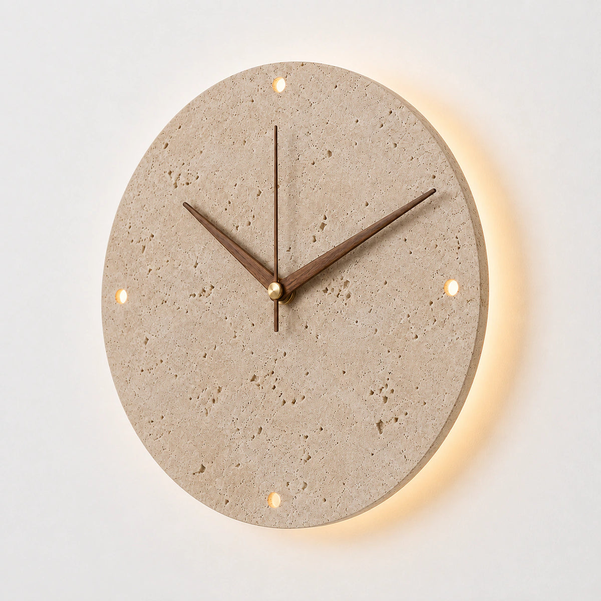 Backlit travertine wall clock with walnut hands and a warm halo