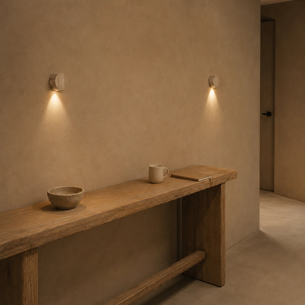 Roundhay travertine disc wall lights lighting a hallway in a period property
