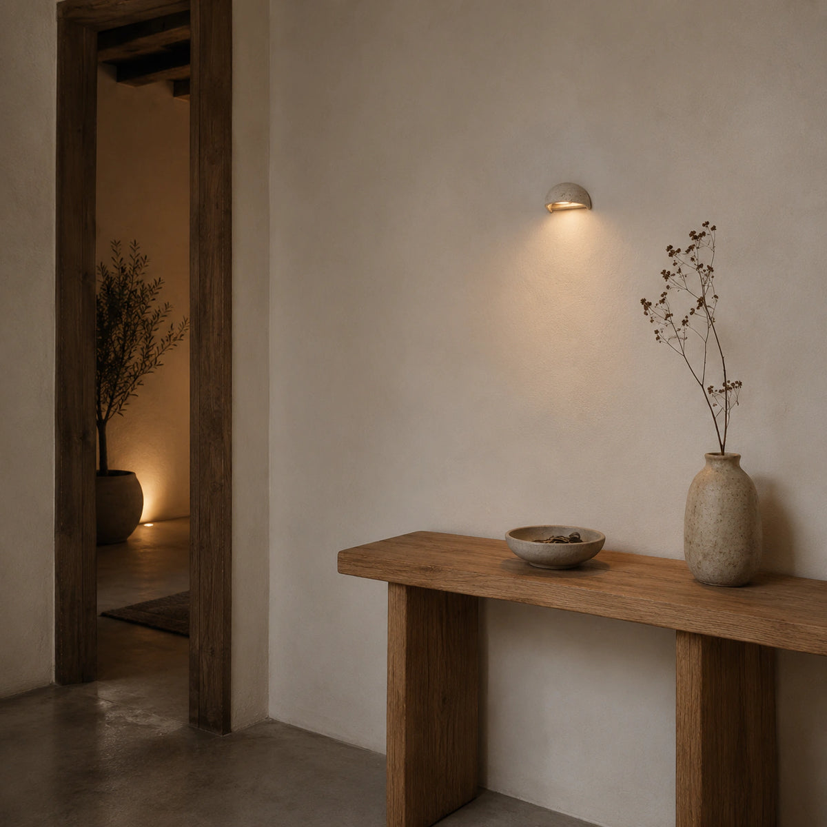 Culver travertine half dome wall light in a hallway of a period property