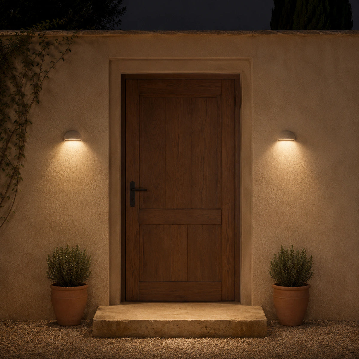 Culver travertine half dome wall light washing a textured exterior wall