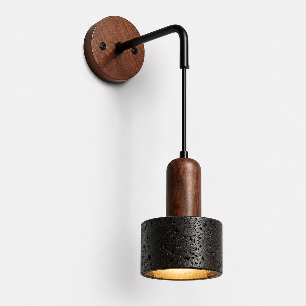 Black travertine wall light with a black adjustable arm and walnut wall plate