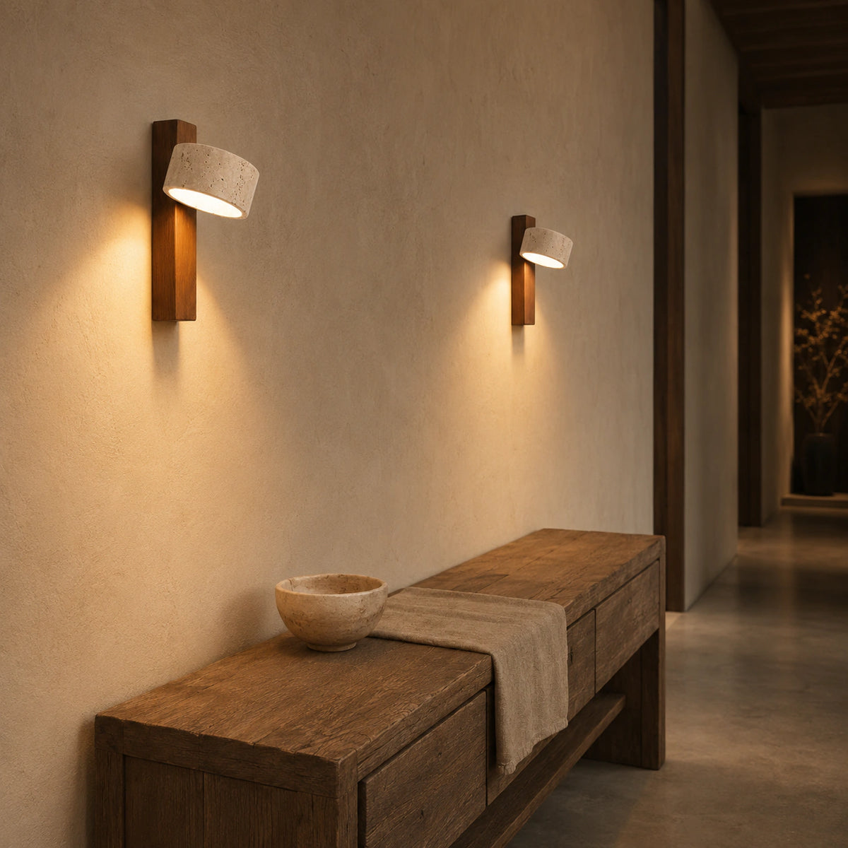 Alnwick travertine drum wall light in a hallway of a period property