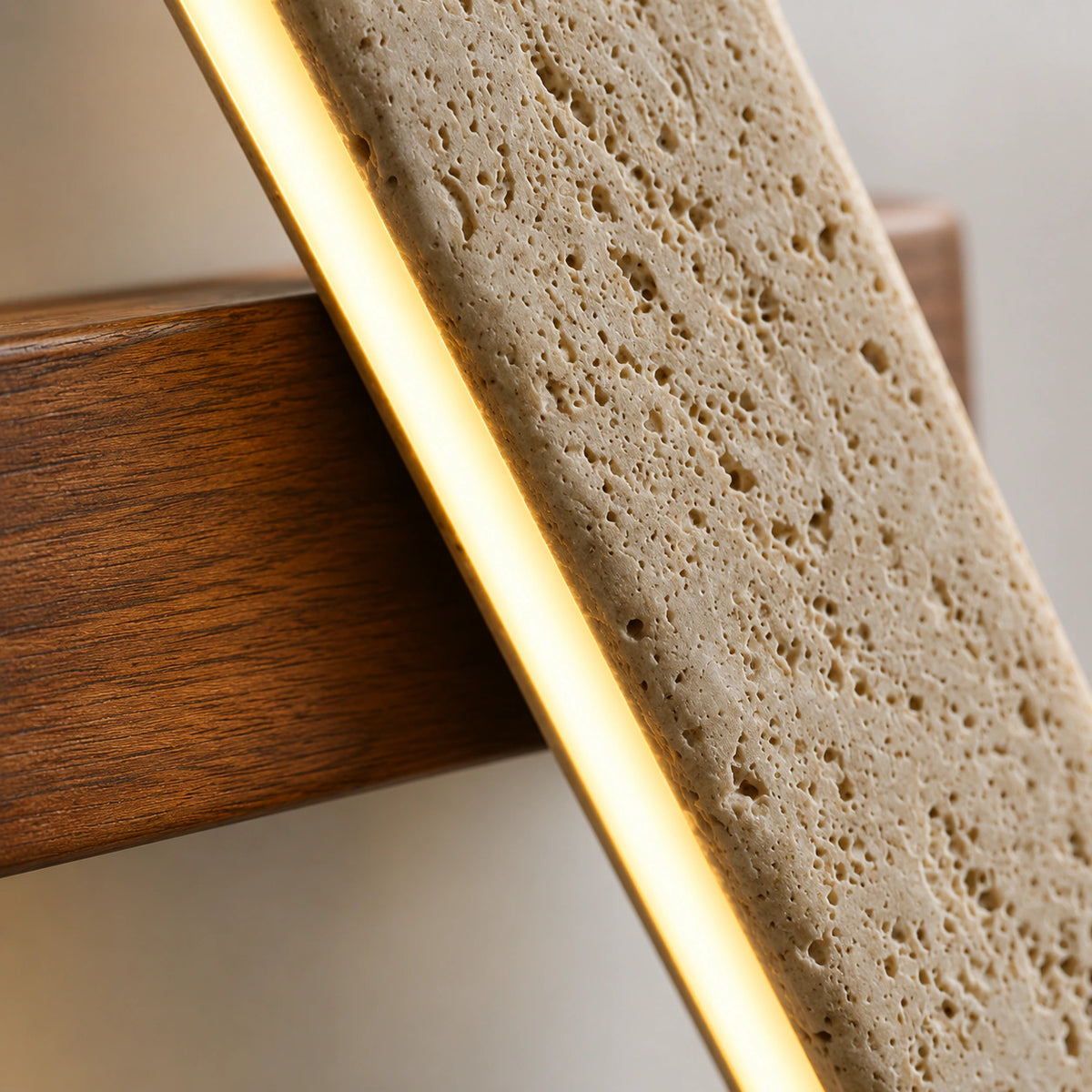 Close-up of the lit edge running along the travertine bar of the Linton wall light