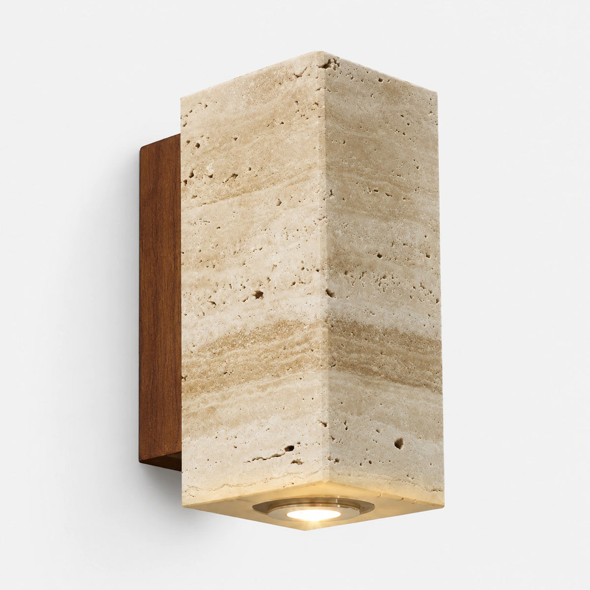 Honey travertine block wall light on a walnut backplate, lit from below
