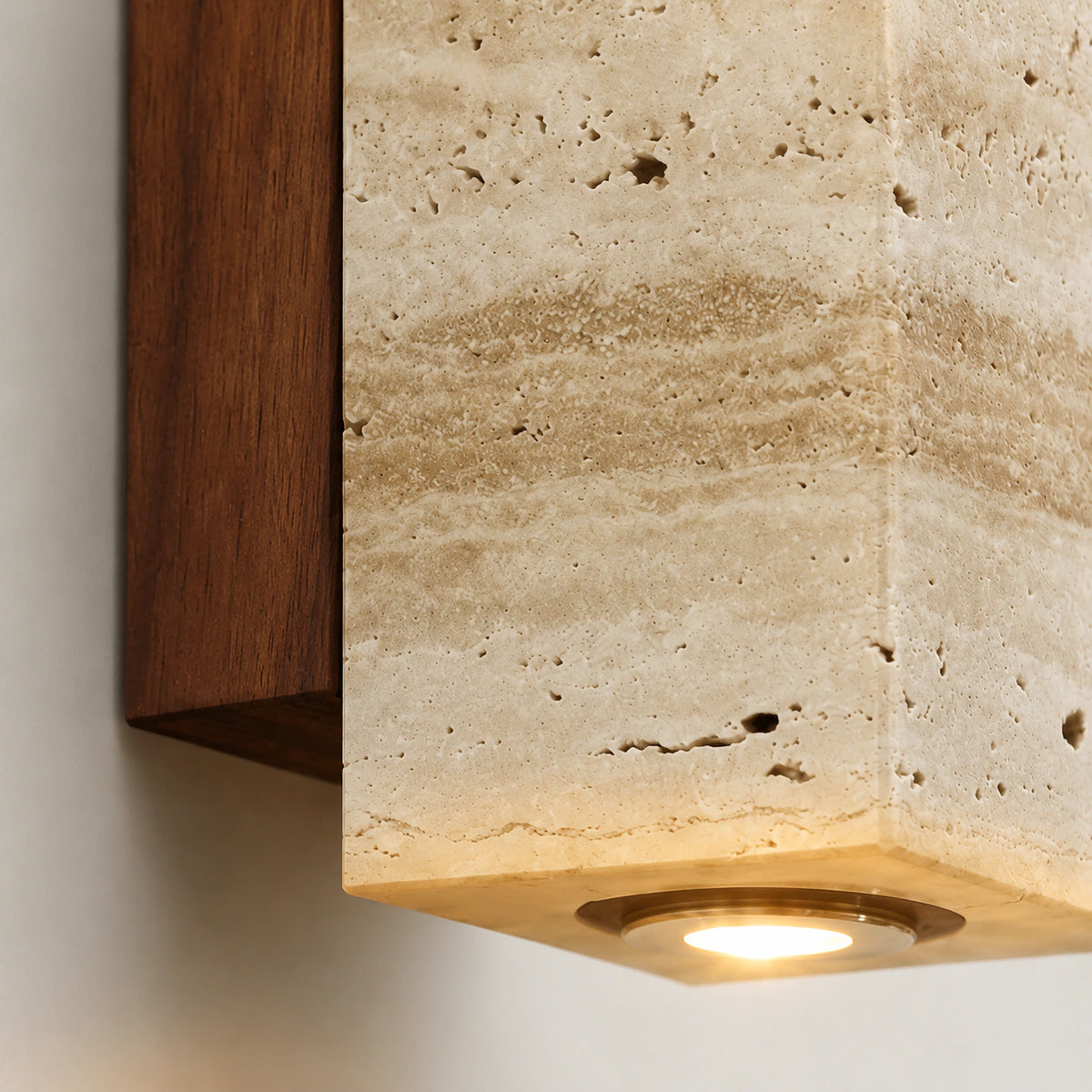 Close-up of the recessed downlight in the base of the Ledbury travertine block