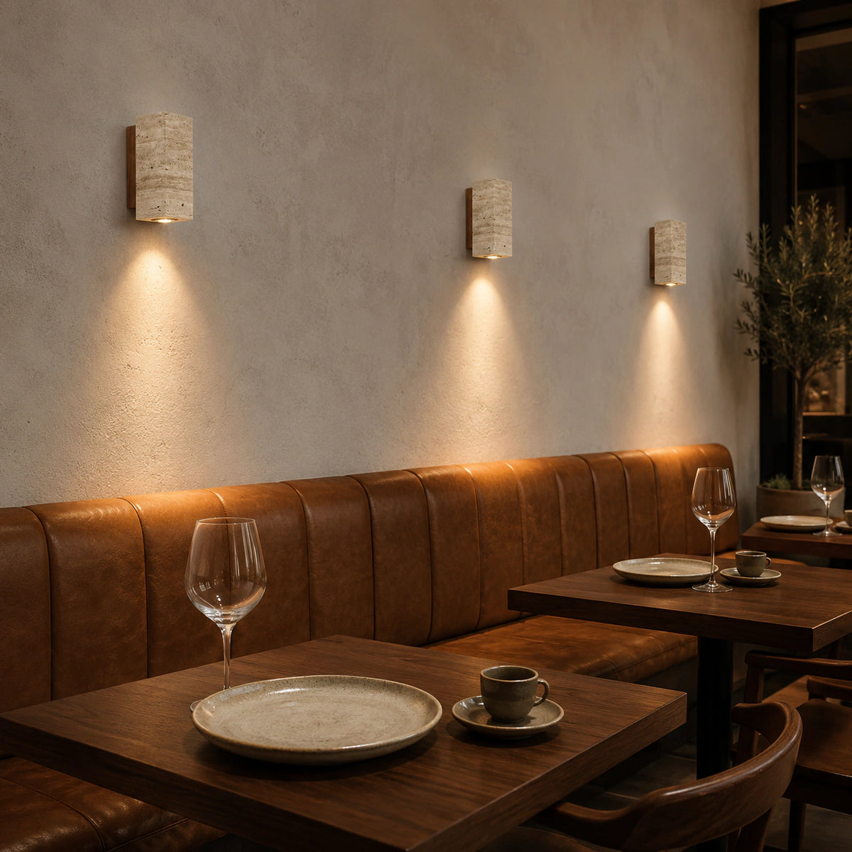 Ledbury travertine block wall lights along a restaurant wall