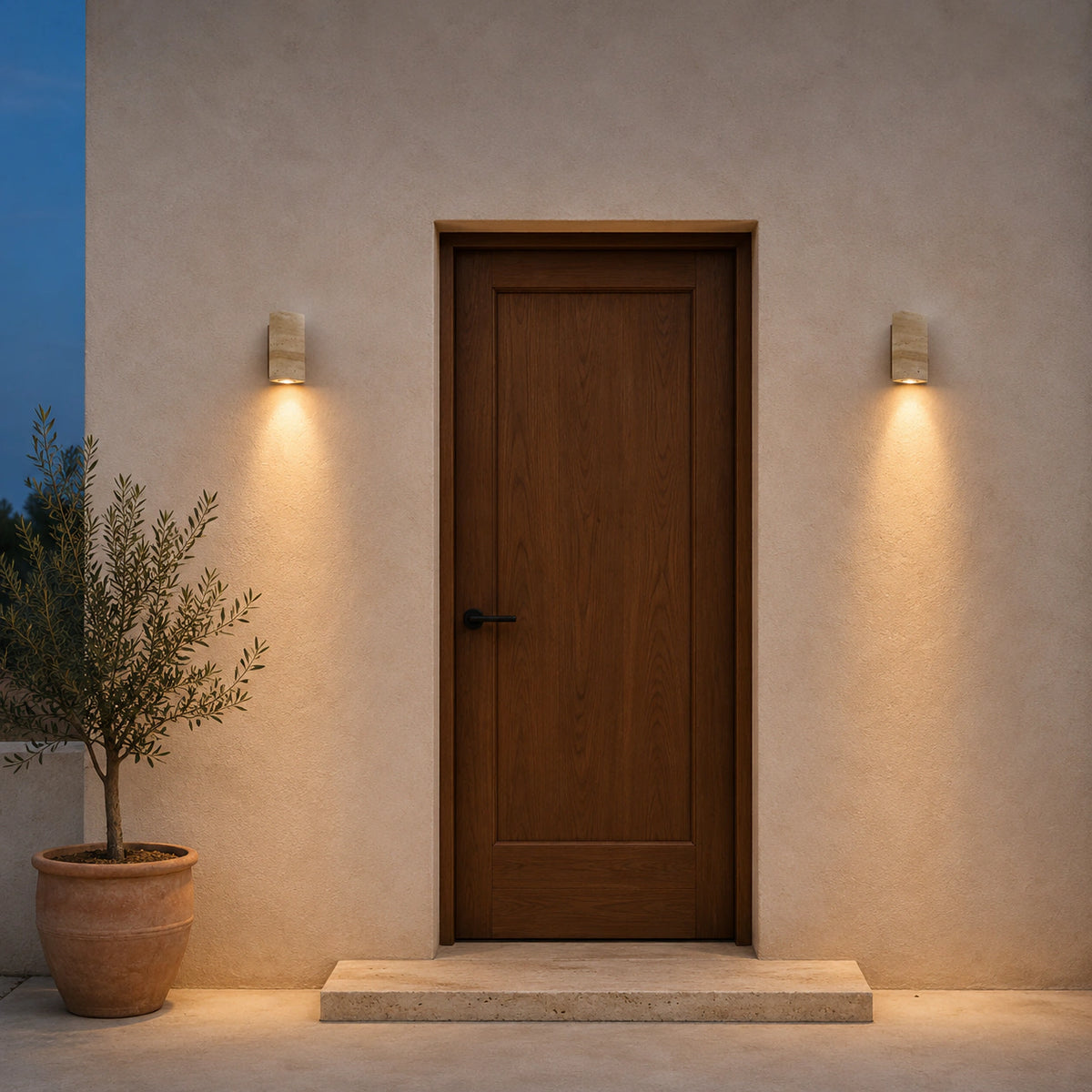 Ledbury travertine block wall light mounted beside an entrance door