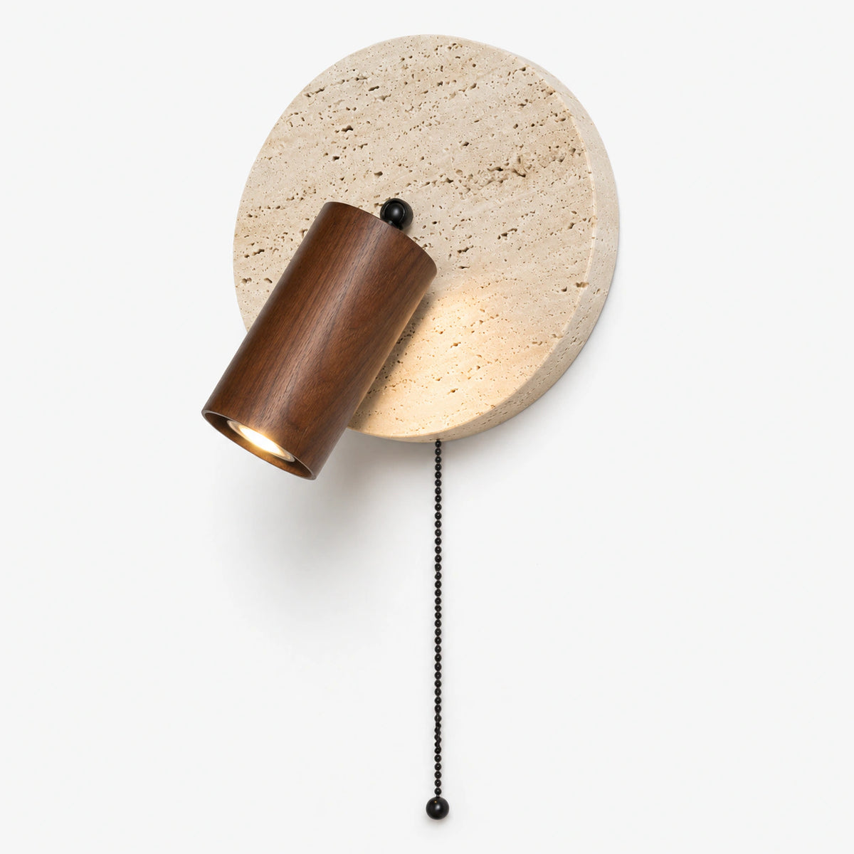 Travertine wall light with a walnut adjustable spot and black pull cord