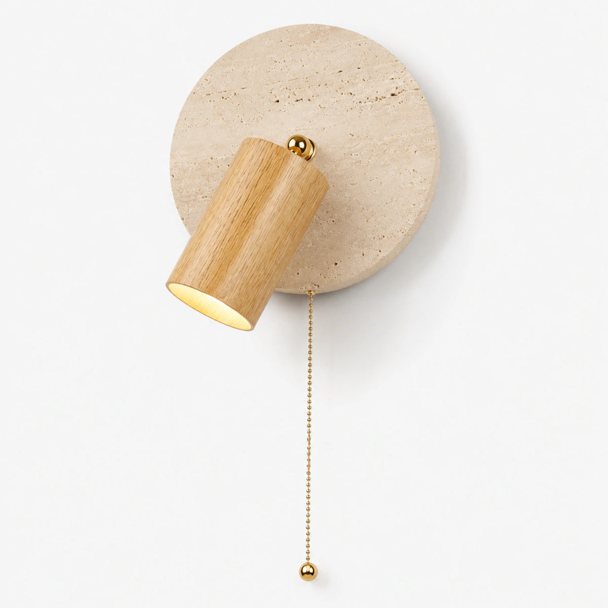 Travertine wall light with an oak adjustable spot and brass pull cord