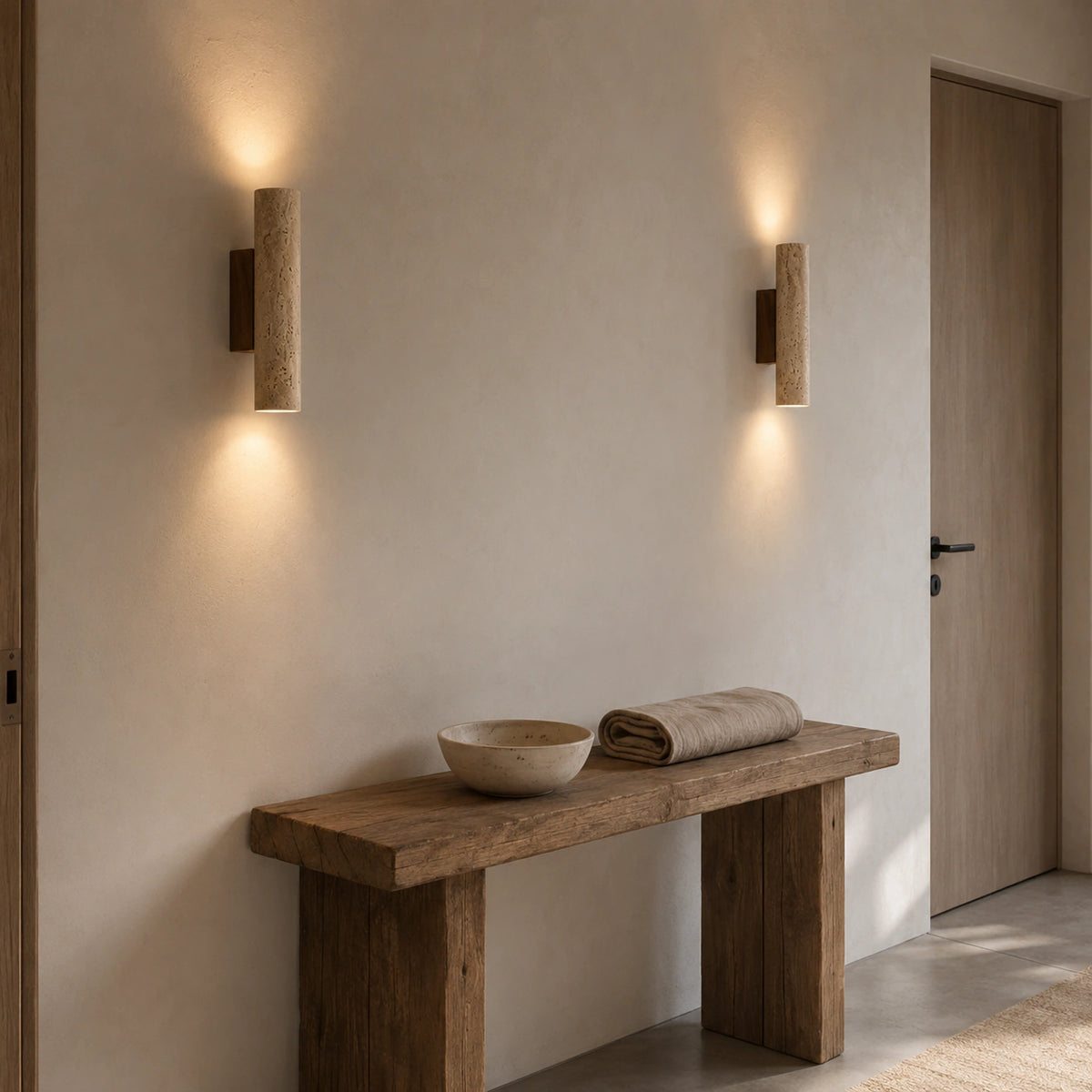 Farndon travertine wall light in a hallway, washing the wall up and down